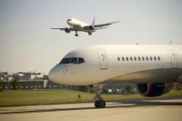 Airplane approaches as another waits to takeoff Aircraft of the future could capture their own energy currently wasted
